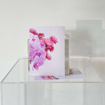 Gift Card Add-On - Floral displayed with colorful flowers on a clear surface, perfect for personal messages.