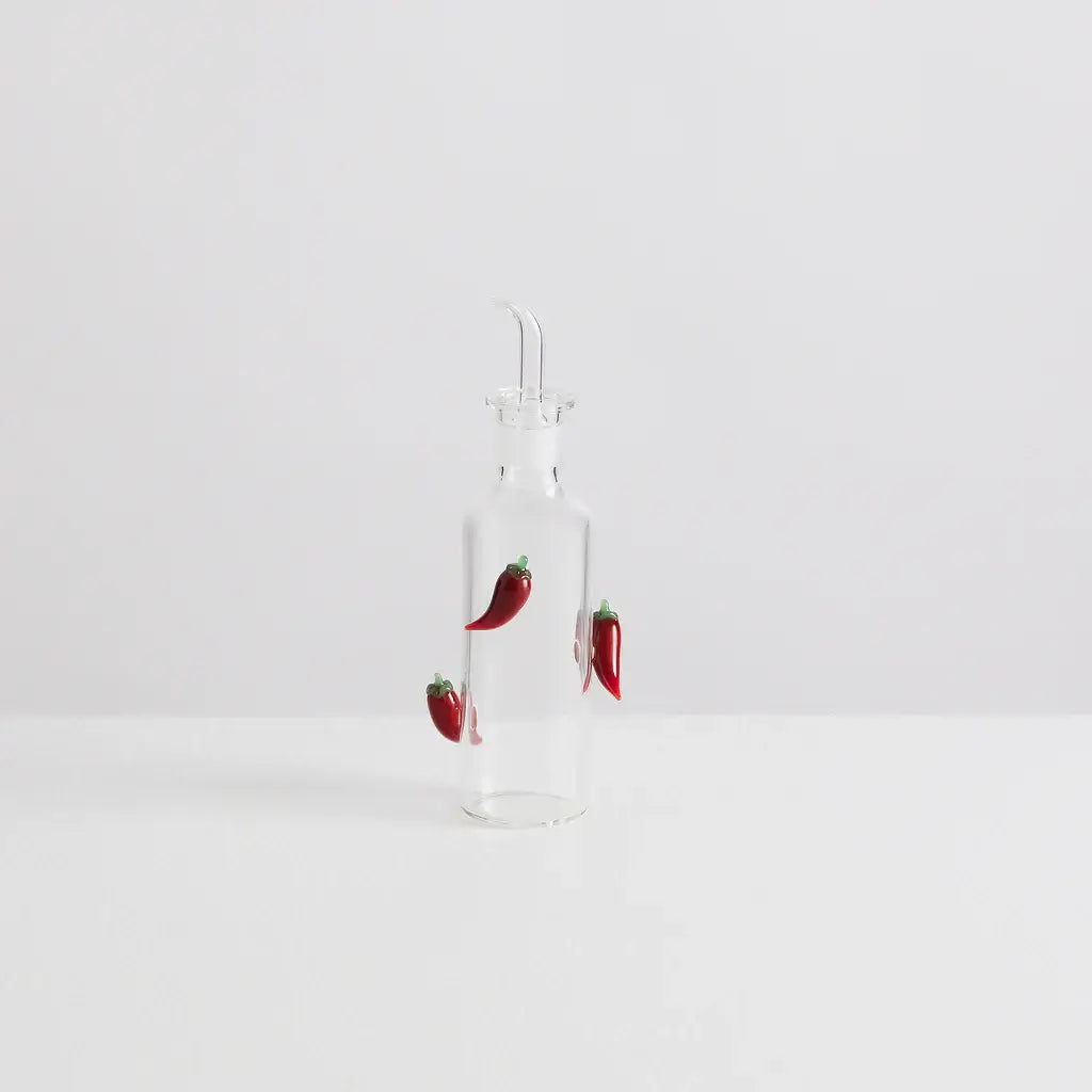 Maison Balzac The Chilli Bottle with handcrafted glass chillies, perfect for dispensing chili oil in style.