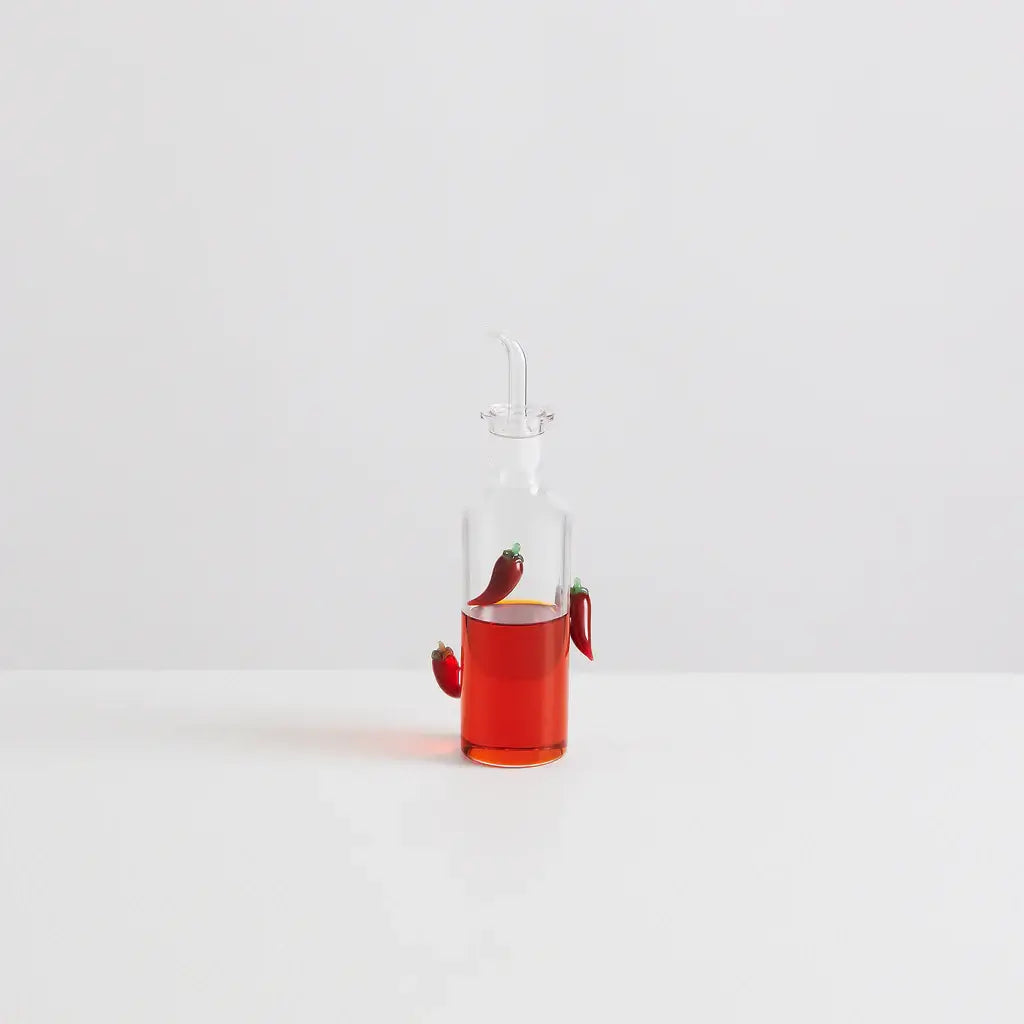 Maison Balzac The Chilli Bottle filled with vibrant chilli oil, featuring handcrafted glass chillies.