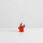 Maison Balzac The Chilli Bottle filled with vibrant chilli oil, featuring handcrafted glass chillies.