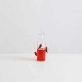 Maison Balzac The Chilli Bottle filled with vibrant chilli oil, featuring handcrafted glass chillies.